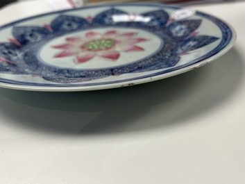 A Chinese famille rose 'lotus' plate for the Southeast Asian market and a 'butterfly and flower' plate, Yongzheng/Qianlong