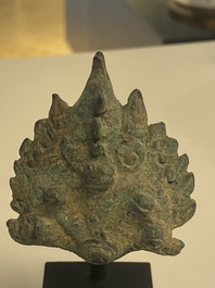 A various collection of bronze khmer palanquin hooks, a bell and a dagger, Angkor Wat periode, Thailand, 12th C.