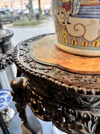 A pair of tall Chinese carved wooden stands with marble tops, 19th C.