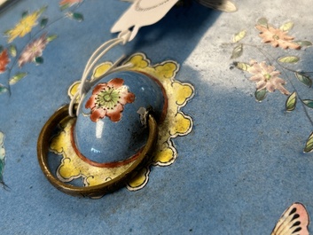 A Chinese Canton enamel circular hand mirror, early 19th C.