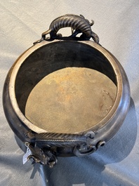 A large Chinese bronze tripod censer with 'chilong' handles, Qing Qian Gong 清乾宮 mark, 18th C.