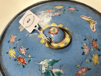 A Chinese Canton enamel circular hand mirror, early 19th C.