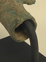 A various collection of bronze khmer palanquin hooks, a bell and a dagger, Angkor Wat periode, Thailand, 12th C.