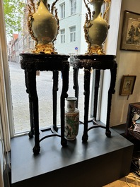 A pair of tall Chinese carved wooden stands with marble tops, 19th C.