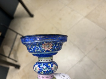 A large Chinese Canton enamel blue-ground 'shou' candlestick, Qianlong/Jiaqing