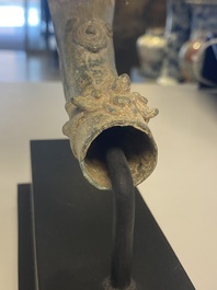 A various collection of bronze khmer palanquin hooks, a bell and a dagger, Angkor Wat periode, Thailand, 12th C.