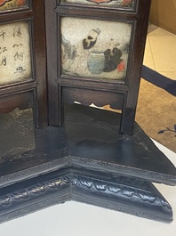 A Chinese seven-fold wooden table screen with painted marble plaques, 19th C.