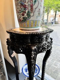 A pair of tall Chinese carved wooden stands with marble tops, 19th C.