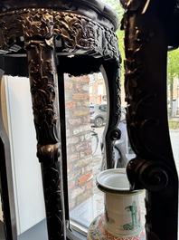 A pair of tall Chinese carved wooden stands with marble tops, 19th C.