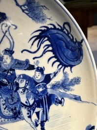 A Chinese blue and white dish with warriors on horseback, 19th C.