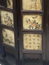 A Chinese seven-fold wooden table screen with painted marble plaques, 19th C.