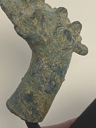 A various collection of bronze khmer palanquin hooks, a bell and a dagger, Angkor Wat periode, Thailand, 12th C.
