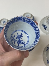 Five Chinese blue and white cups and four saucers with boys carrying a vase, Kangxi mark, Guangxu