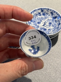 Four Chinese blue and white miniature cups and saucers, butterfly mark, Kangxi