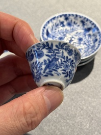 Four Chinese blue and white miniature cups and saucers, butterfly mark, Kangxi