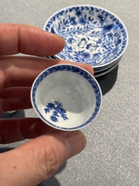 Four Chinese blue and white miniature cups and saucers, butterfly mark, Kangxi