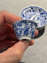 Four Chinese blue and white miniature cups and saucers, butterfly mark, Kangxi