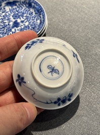 Four Chinese blue and white miniature cups and saucers, butterfly mark, Kangxi