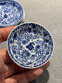 Four Chinese blue and white miniature cups and saucers, butterfly mark, Kangxi