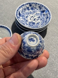 Four Chinese blue and white miniature cups and saucers, butterfly mark, Kangxi