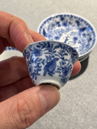 Four Chinese blue and white miniature cups and saucers, butterfly mark, Kangxi