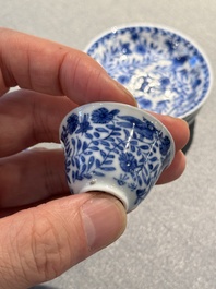 Four Chinese blue and white miniature cups and saucers, butterfly mark, Kangxi