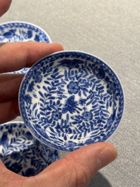 Four Chinese blue and white miniature cups and saucers, butterfly mark, Kangxi