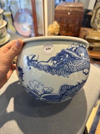 A Chinese blue and white 'dragon and carp' jardini&egrave;re, 19th C.
