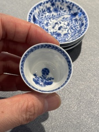 Four Chinese blue and white miniature cups and saucers, butterfly mark, Kangxi