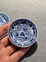 Four Chinese blue and white miniature cups and saucers, butterfly mark, Kangxi