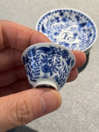 Four Chinese blue and white miniature cups and saucers, butterfly mark, Kangxi