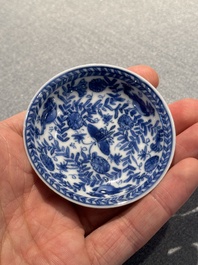 Four Chinese blue and white miniature cups and saucers, butterfly mark, Kangxi