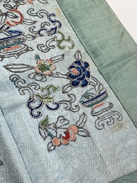 A varied collection of Chinese embroidered silk cloths, a fan-cover and 'rank badges', 19th C.