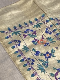 A varied collection of Chinese embroidered silk cloths, a fan-cover and 'rank badges', 19th C.