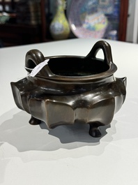 A Chinese bronze lotus-shaped tripod censer, Xuande mark, 18/19th C.