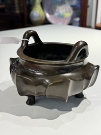 A Chinese bronze lotus-shaped tripod censer, Xuande mark, 18/19th C.