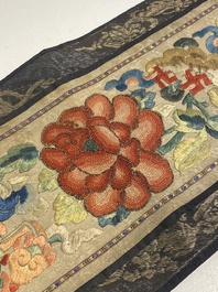 A varied collection of Chinese embroidered silk cloths, a fan-cover and 'rank badges', 19th C.