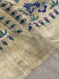A varied collection of Chinese embroidered silk cloths, a fan-cover and 'rank badges', 19th C.