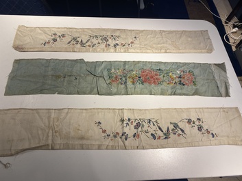 A varied collection of Chinese embroidered silk cloths, a fan-cover and 'rank badges', 19th C.