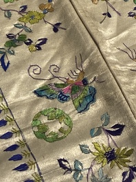 A varied collection of Chinese embroidered silk cloths, a fan-cover and 'rank badges', 19th C.