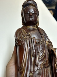 A Chinese partly gilt and lacquered wooden sculpture of Guanyin, Ming