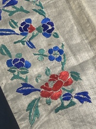 A varied collection of Chinese embroidered silk cloths, a fan-cover and 'rank badges', 19th C.