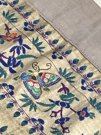 A varied collection of Chinese embroidered silk cloths, a fan-cover and 'rank badges', 19th C.