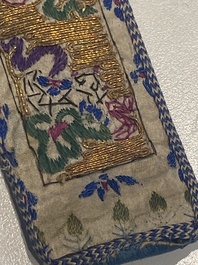 A varied collection of Chinese embroidered silk cloths, a fan-cover and 'rank badges', 19th C.