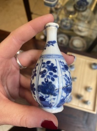 Fourteen Chinese blue and white miniature vases with floral design, Kangxi