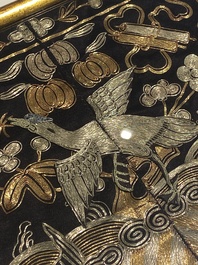 A varied collection of Chinese embroidered silk cloths, a fan-cover and 'rank badges', 19th C.