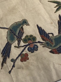 A varied collection of Chinese embroidered silk cloths, a fan-cover and 'rank badges', 19th C.