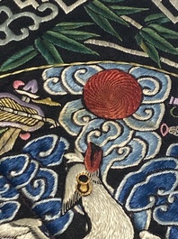A varied collection of Chinese embroidered silk cloths, a fan-cover and 'rank badges', 19th C.