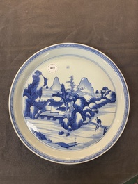 A Chinese blue and white plate with a mountainous river landscape, Chenghua mark, Kangxi