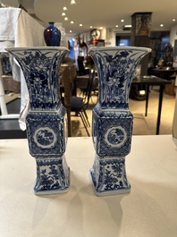 A pair of Chinese blue and white 'gu' vases with floral design, Kangxi